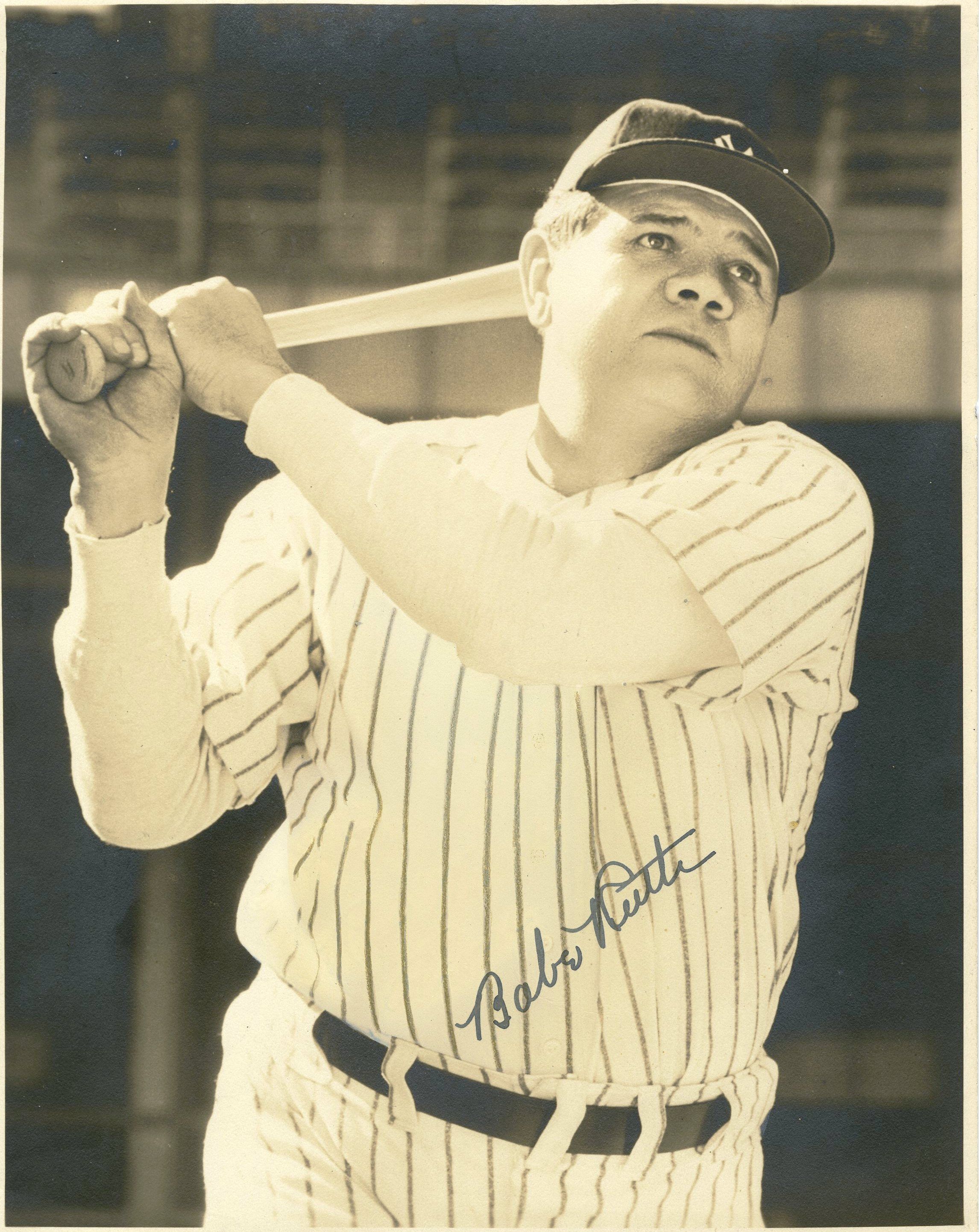 Autographed Picture of Babe Ruth Swinging the Bat in Yankees Uniform